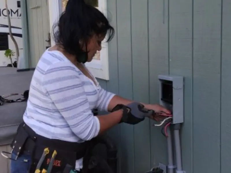 Licensed electrician wiring an exterior subpanel in Brook Park